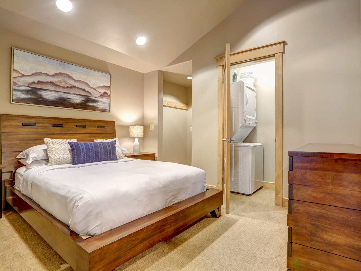 View of bedroom and washer/dryer from entryway