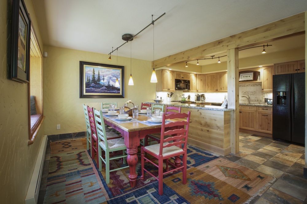 View into the 8-person dining area with reading alcove into the kitchen area.