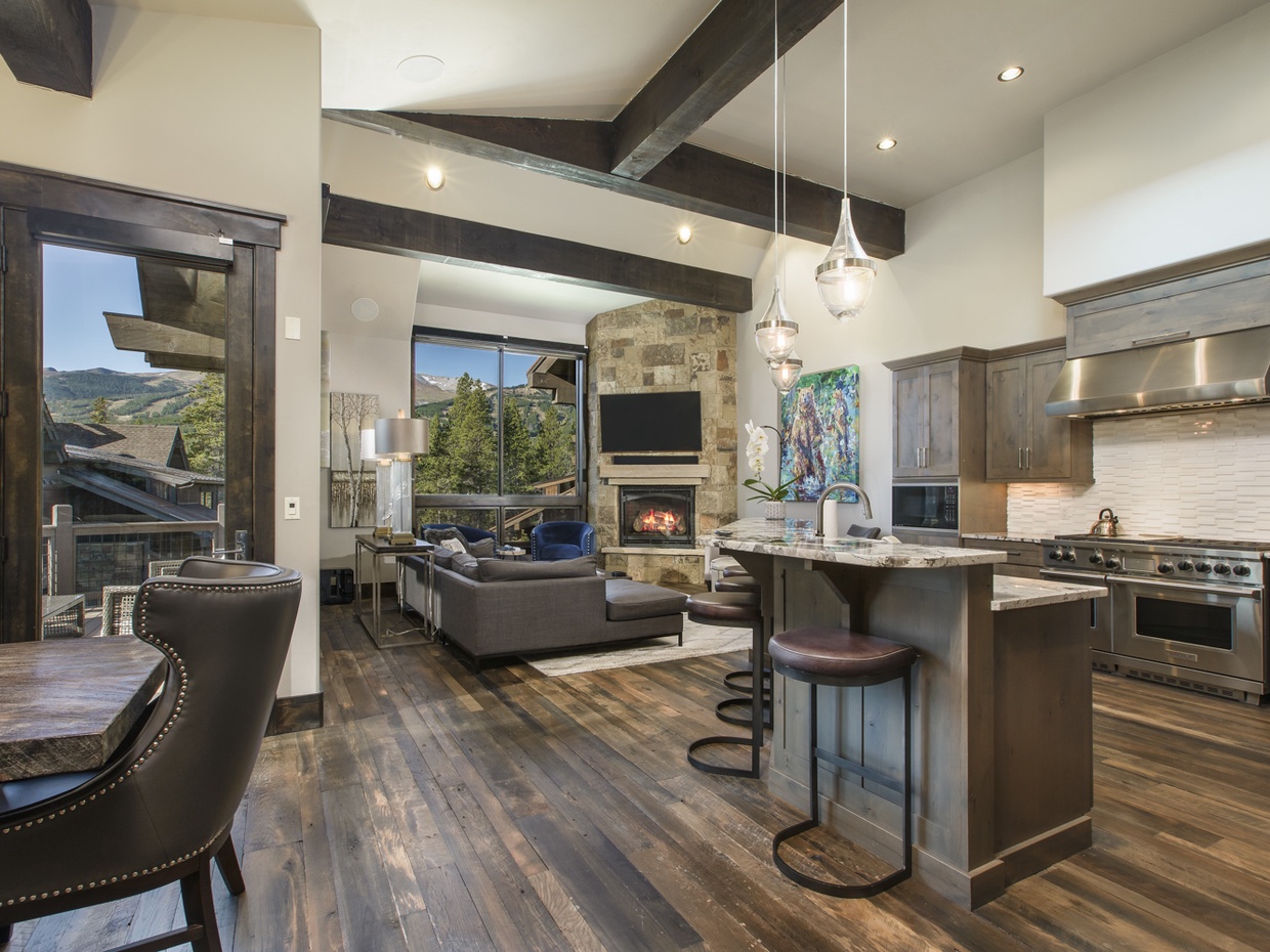 View from the main entrance into the great room with kitchen, dining, and family room.