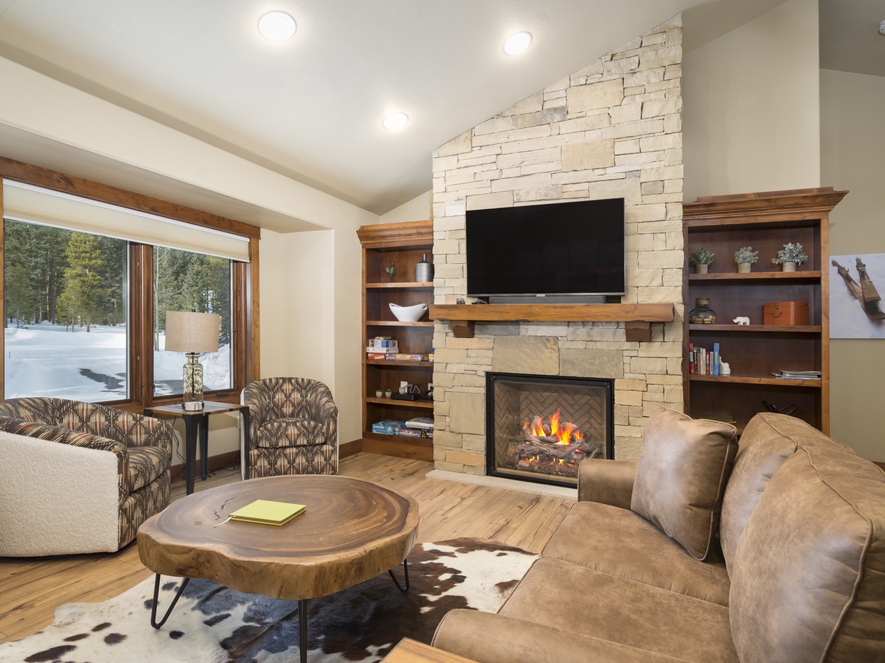 Living room - board games, puzzles, books to enjoy by the fire along with Roku TV for streaming movies and other favorites for the family