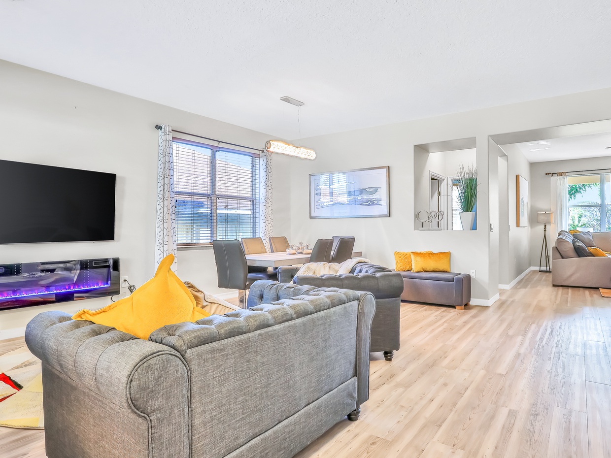 1st floor entry seating area with TV & electric fire place