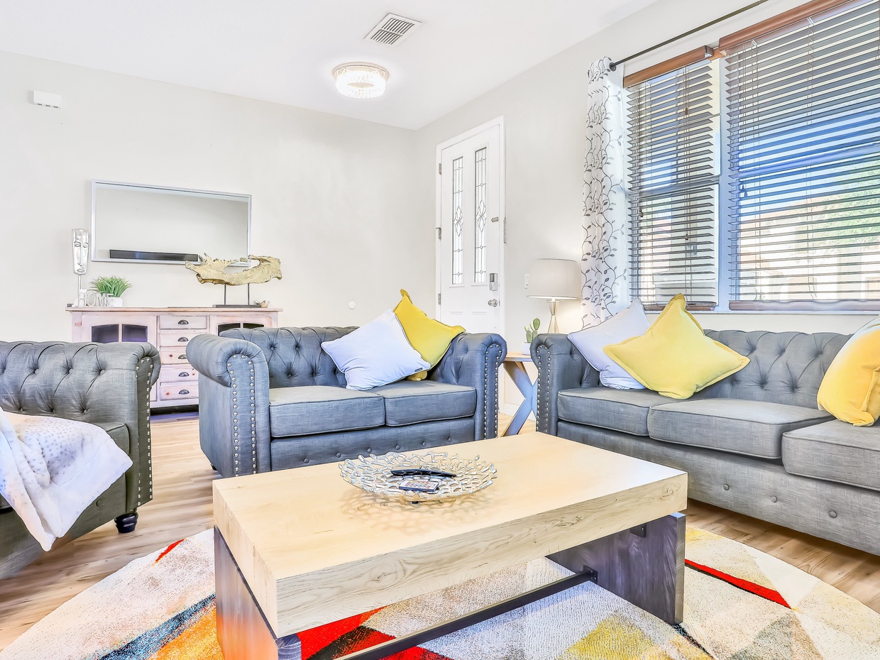 1st floor entry seating area with TV & electric fire place