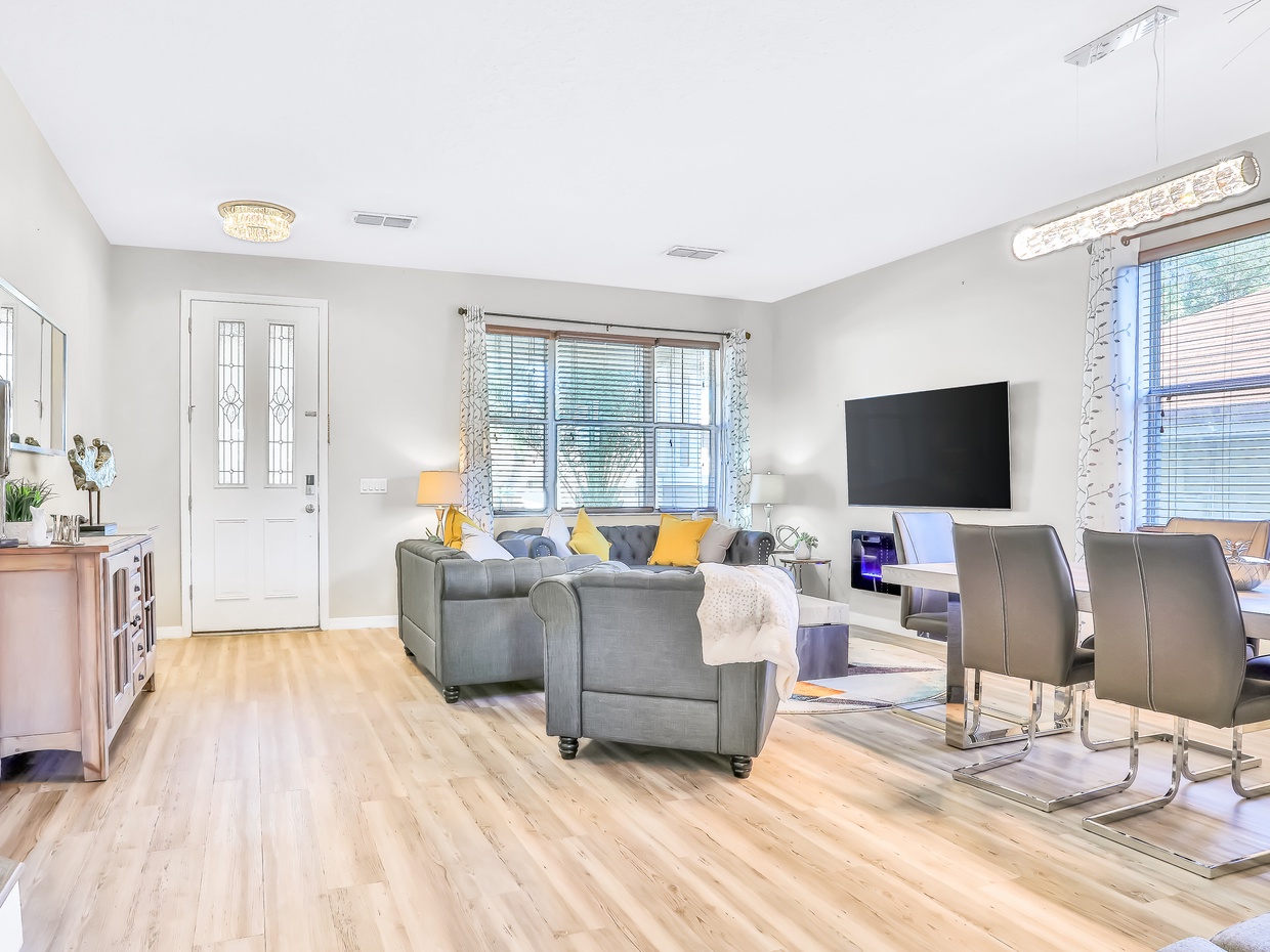 1st floor entry seating area with TV & electric fire place