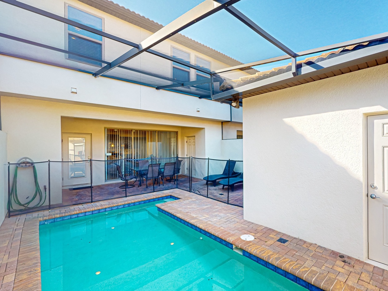 Lanai with private pool, loungers, outdoor dining area & 1/2 bath