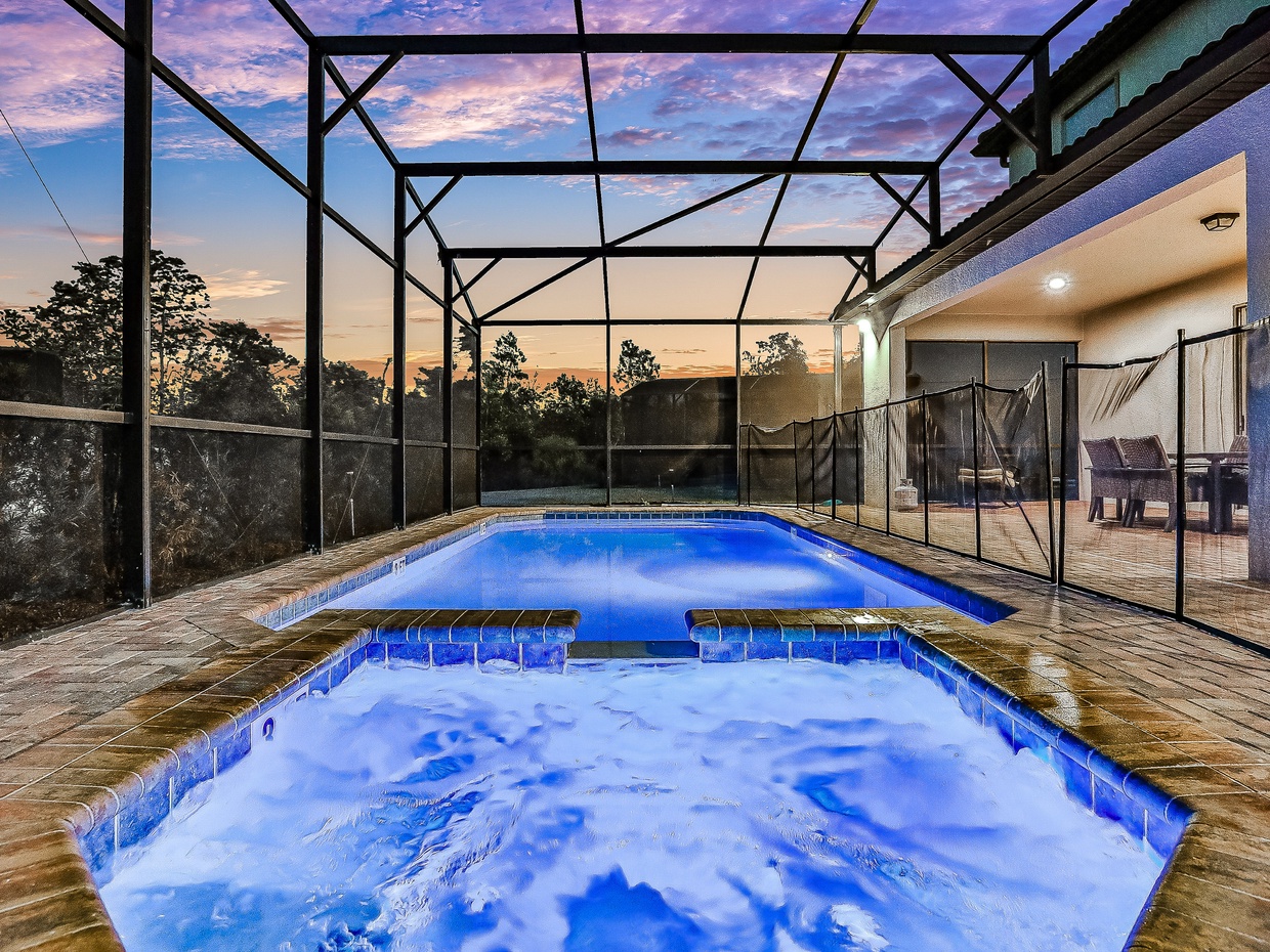 Private, screened in pool with custom lighting