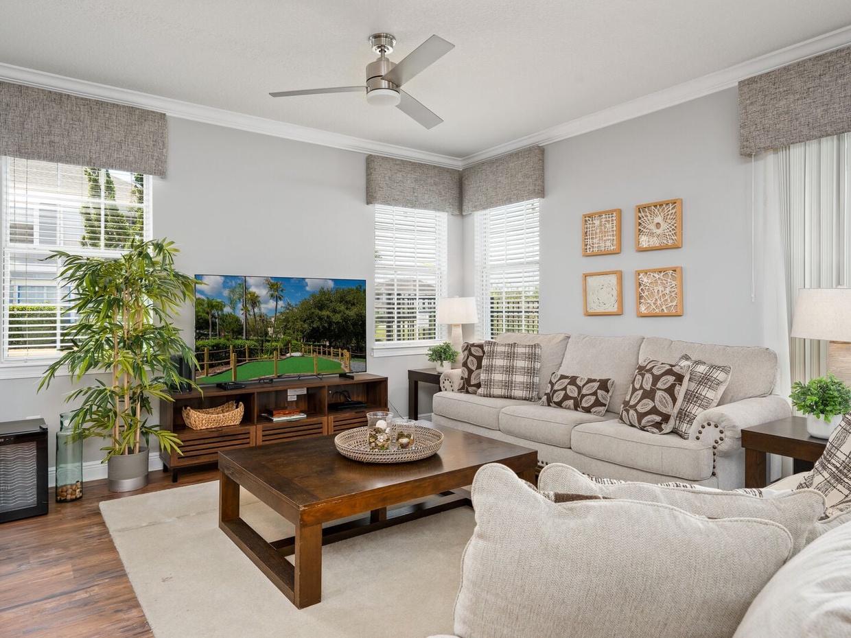 Enjoy ample seating, in the cozy living room, perfect for movie nights.