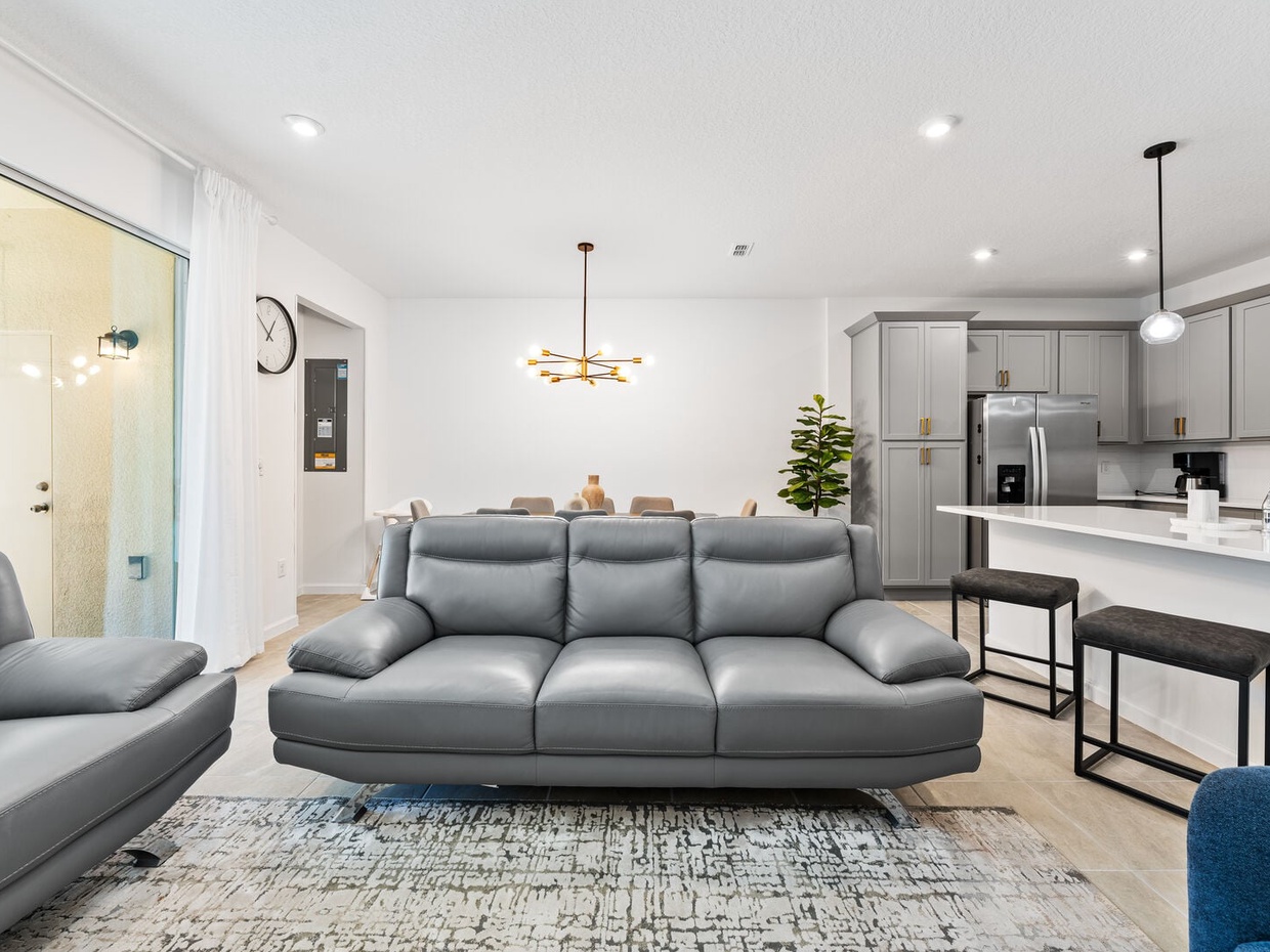 Enjoy a movie night in our cozy living room, complete with a large-screen TV and comfortable plush seating.