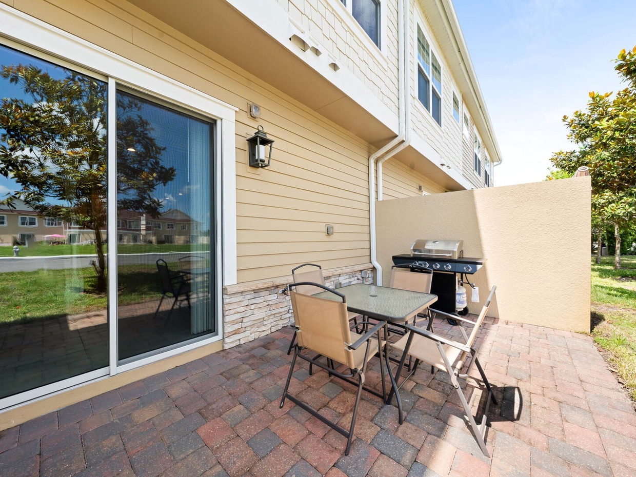Step outside to the open patio, complete with a BBQ grill, perfect for casual outdoor dining.