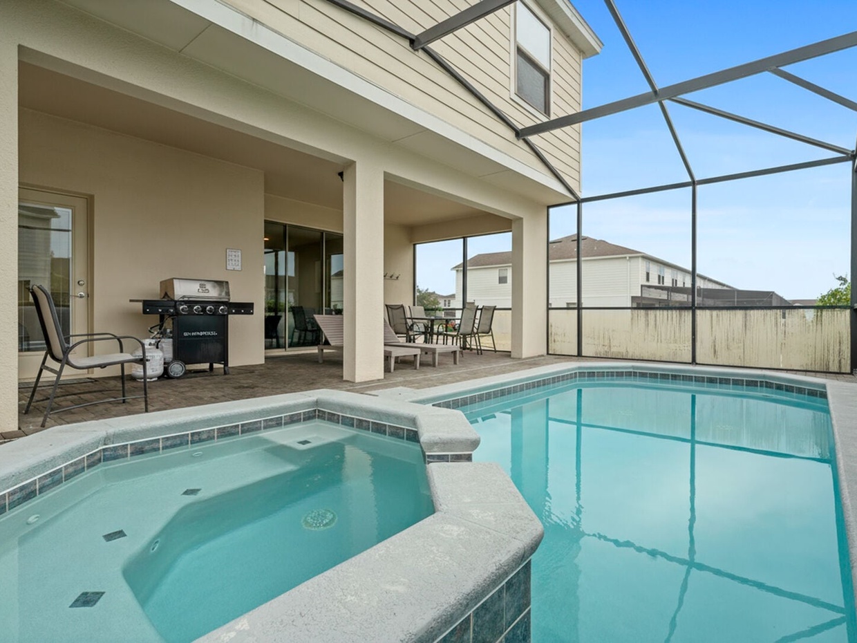 Our patio features a private pool, a BBQ grill, and a comfortable al fresco dining area to enjoy meals outdoors under the Florida sun.