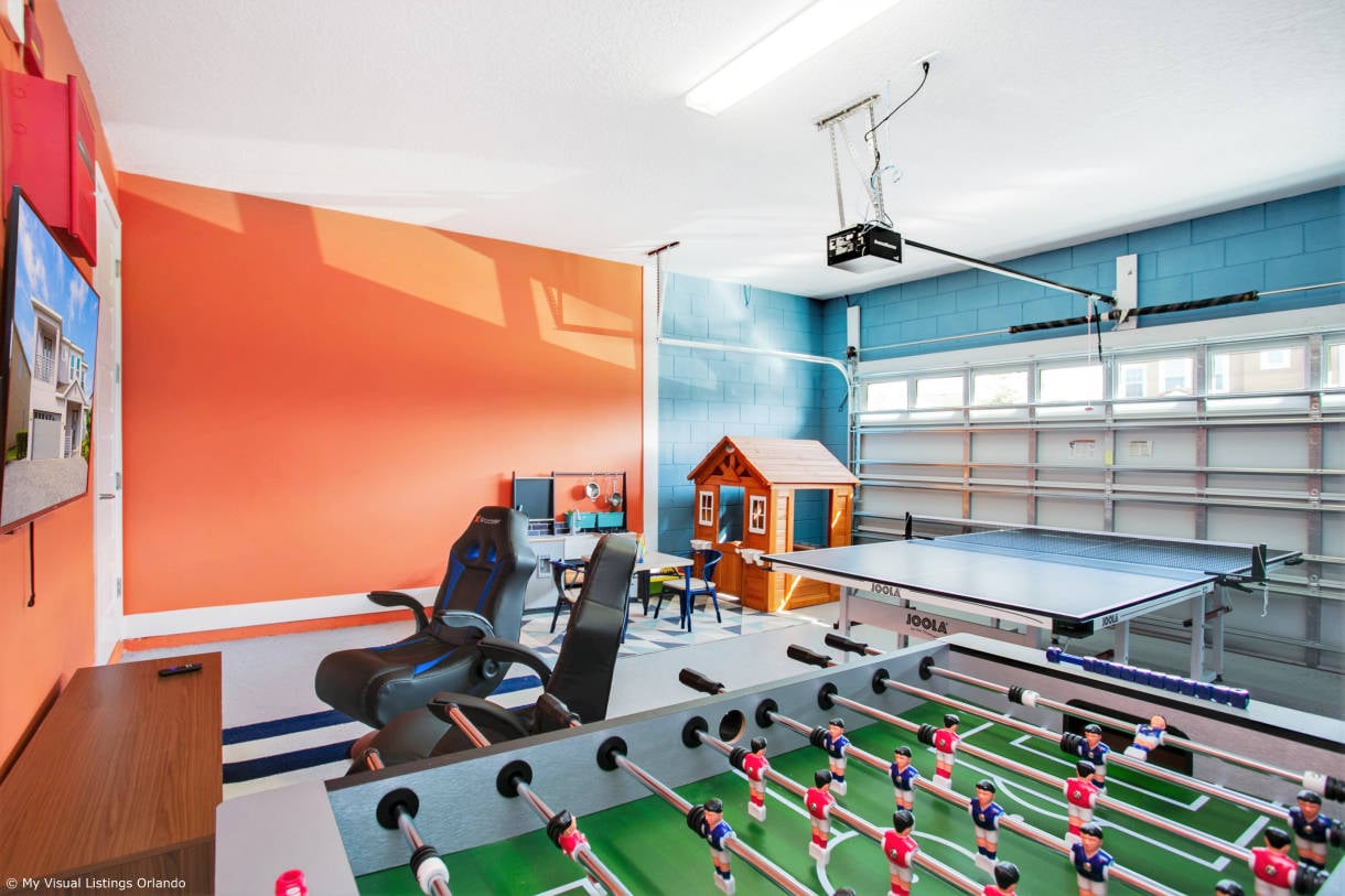 In need of more entertainment? The house also features a game room with a foosball table, ping-pong and game console.