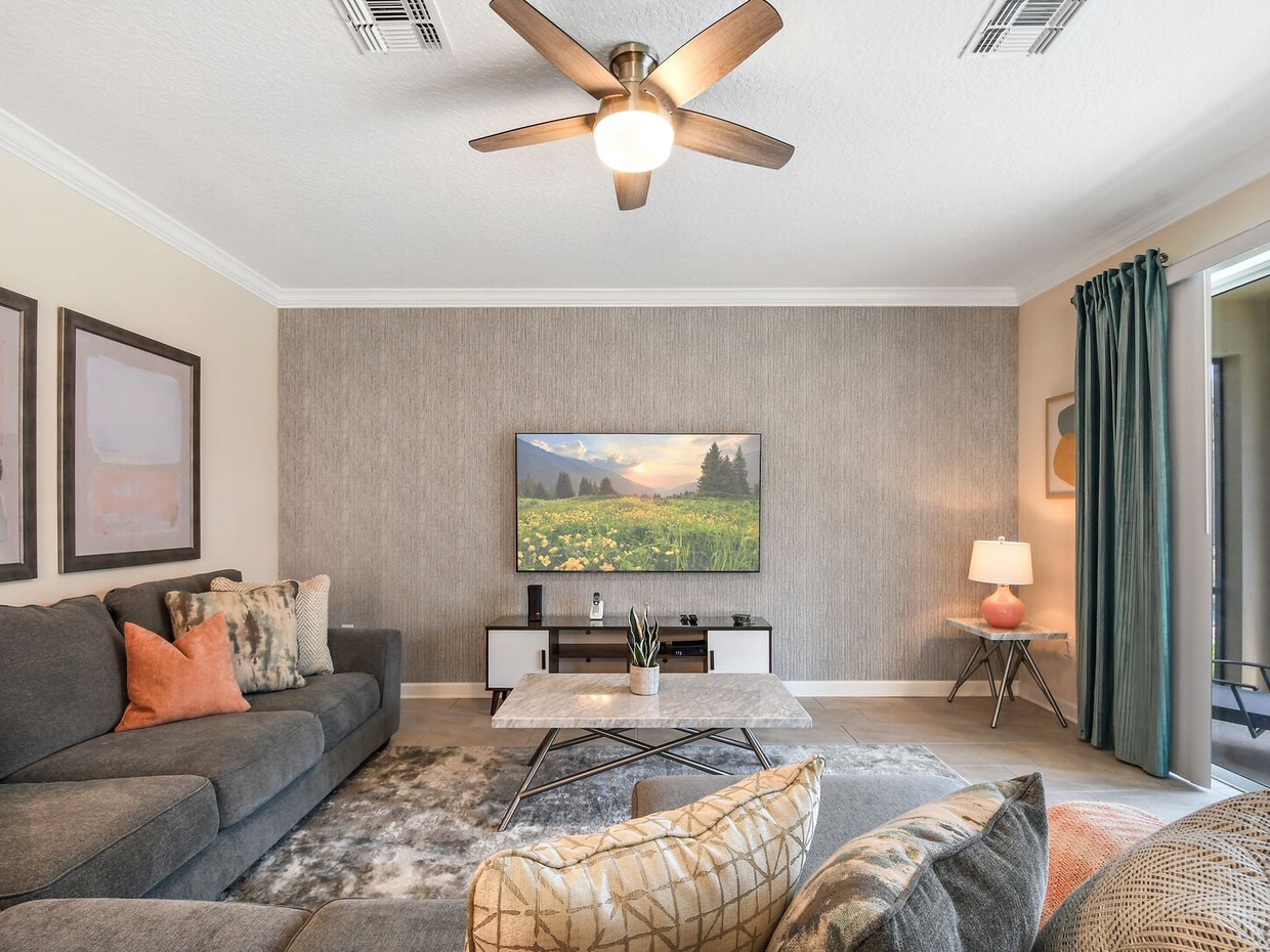 Beautiful, spacious living room featuring its own flat-screen TV, perfect for quality family time.