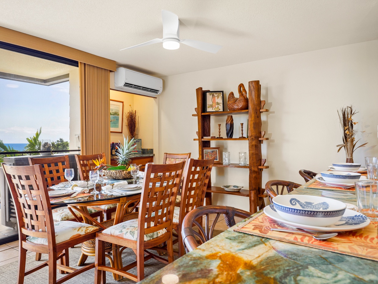 This inviting dining area features a beautiful glass-top table, comfortable seating for family meals, and an open layout leading to the lanai. With ocean views and local decor, it’s the perfect place to savor a sunset dinner or start your day with island fruit and Kona coffee