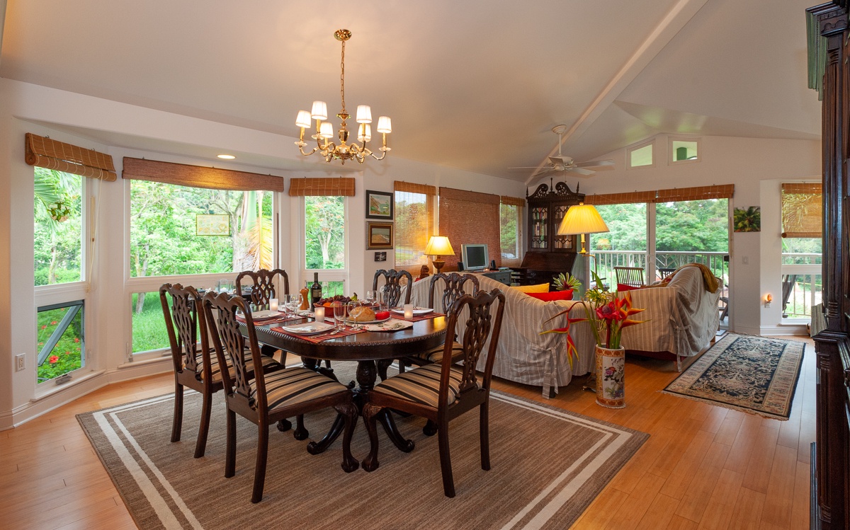 Inside you'll find a warm and homey living and dining area, with plenty of windows to let in natural light and enjoy the lush surroundings.