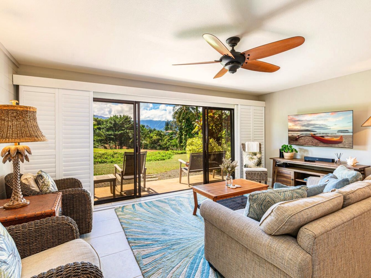Inside you'll find a comfortable and inviting living space, with updated finishes and plenty of natural light! The couches are comfortable, the TV is plenty big, and the room catches a lovely breeze when the screen doors are open.