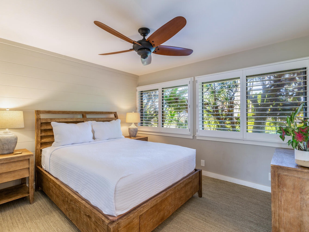 The second bedroom is equally as welcoming, with a plush queen sized bed, garden views from the picture windows, and another ensuite bathroom for a private stay.