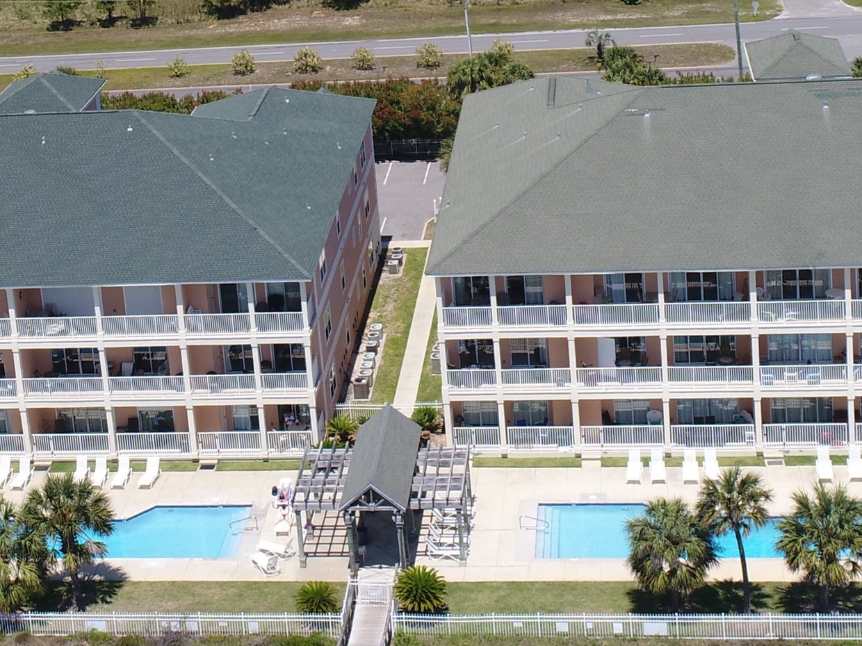 Aerial View of Condo Complex featuring Two Pools 