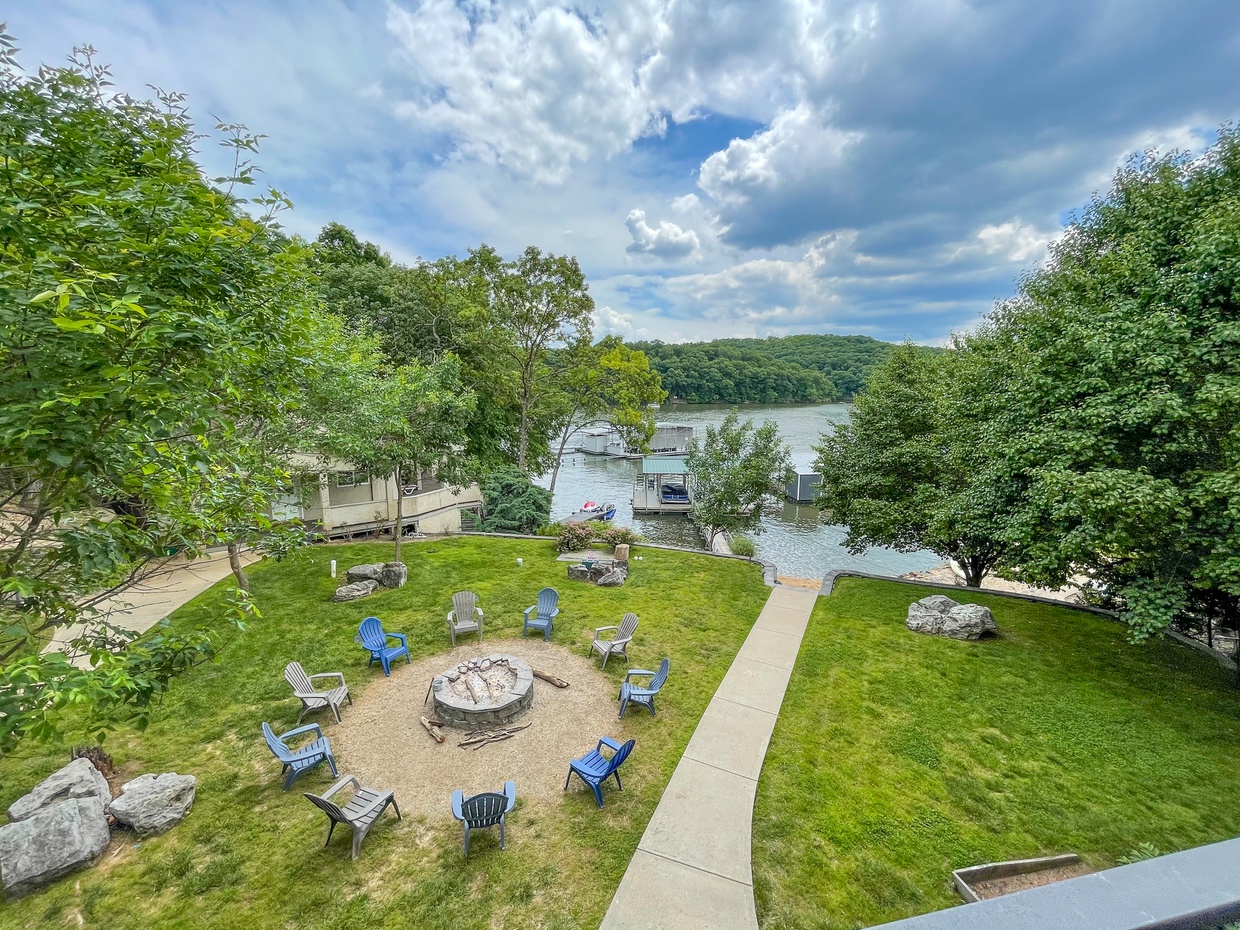 LAKESIDE EXTERIOR WITH FIREPIT AND VIEW OF COTTAGE