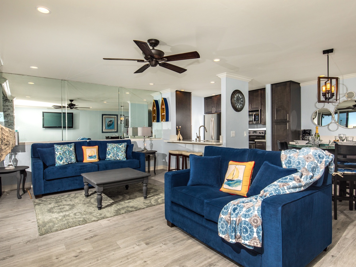 The living room features gorgeous wood-look porcelain floors.