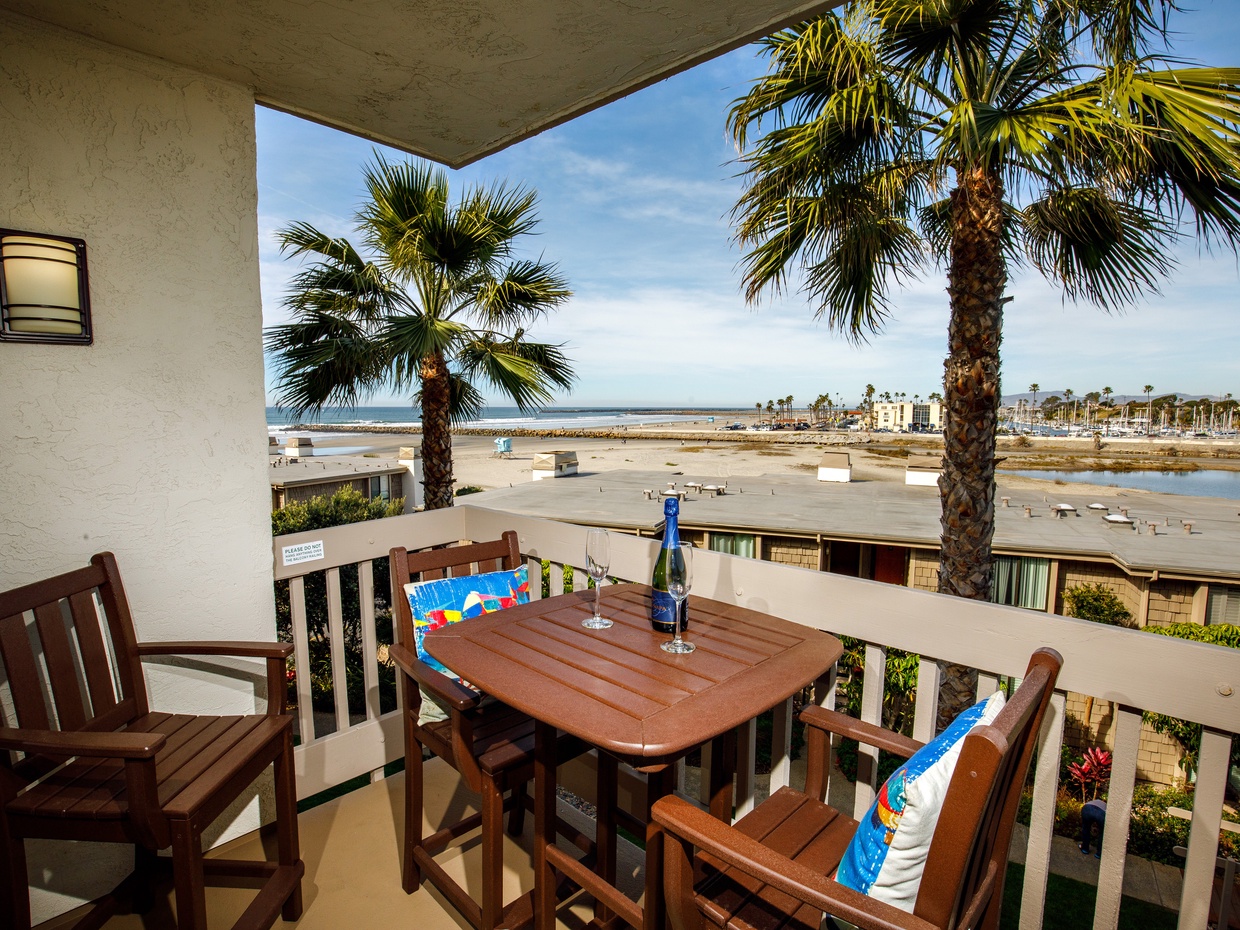 From your balcony you have a view of the ocean,  the sandy beach, the harbor, river, and mountains.