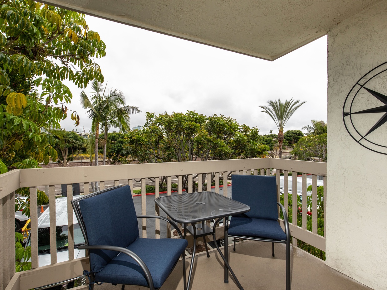 The balcony is off the living room.