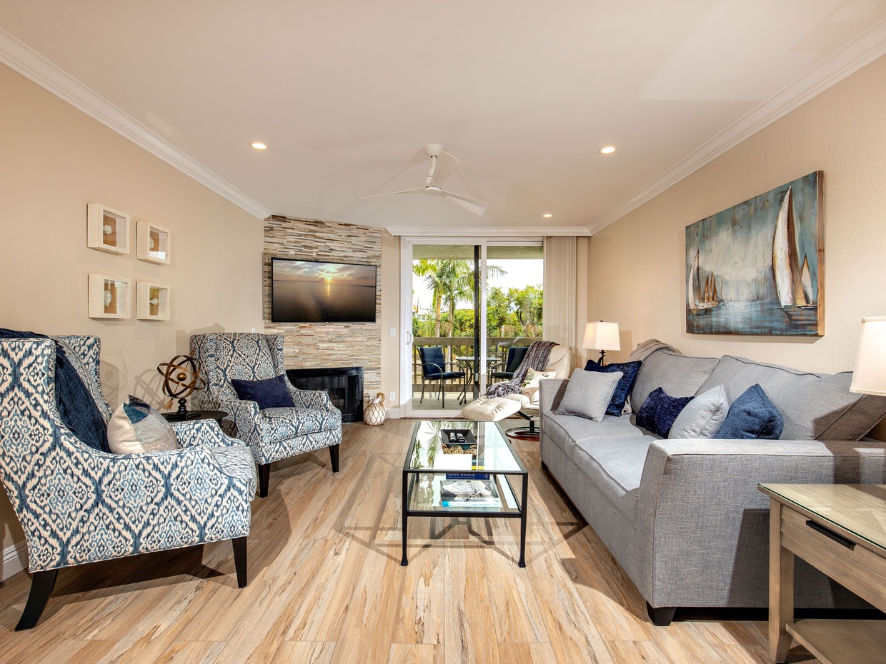 The gorgeous living room of Beach Bliss is furnished with a custom-made queen sleeper sofa with an extra deep mattress.