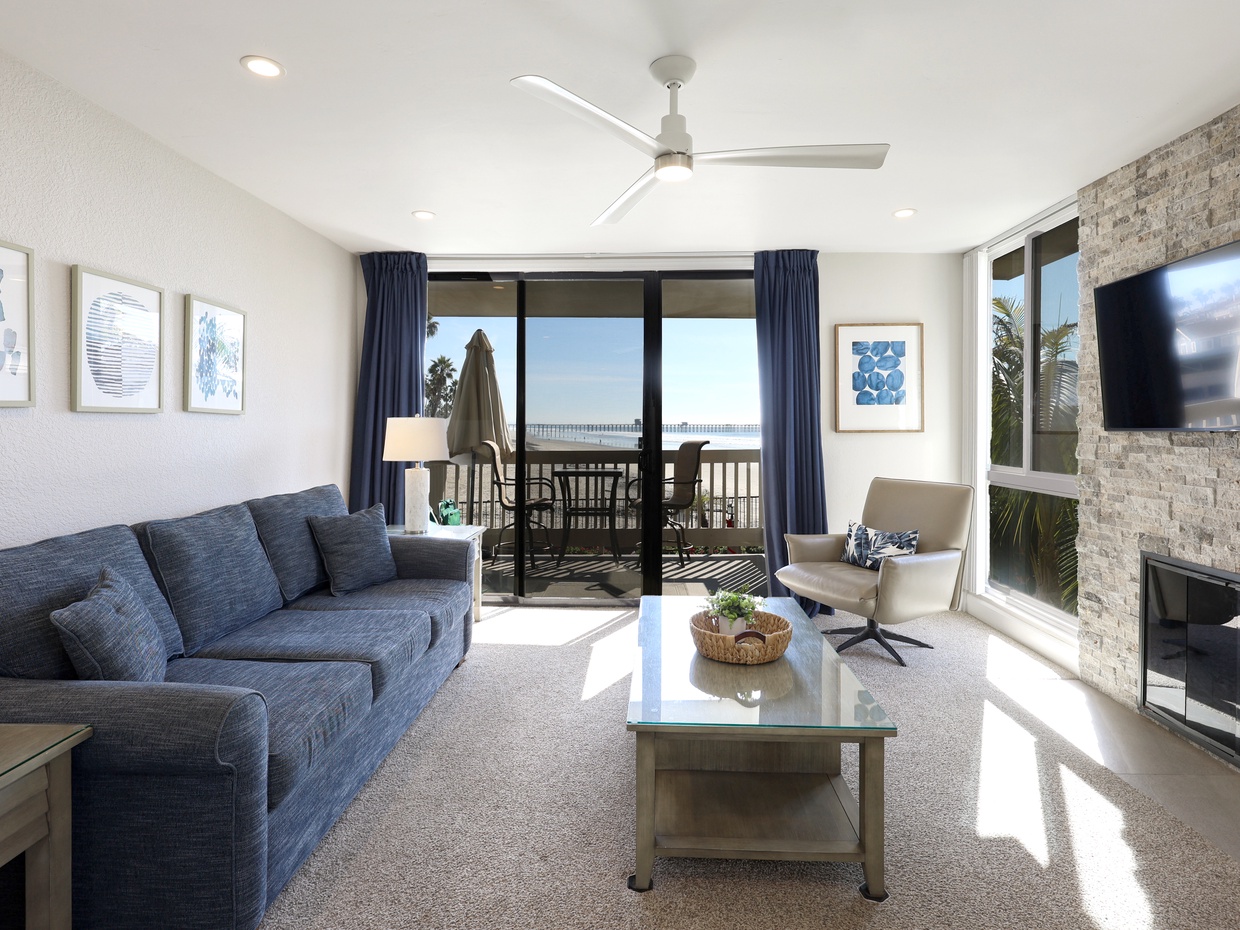 Relax in the living room while looking out at the beach and ocean