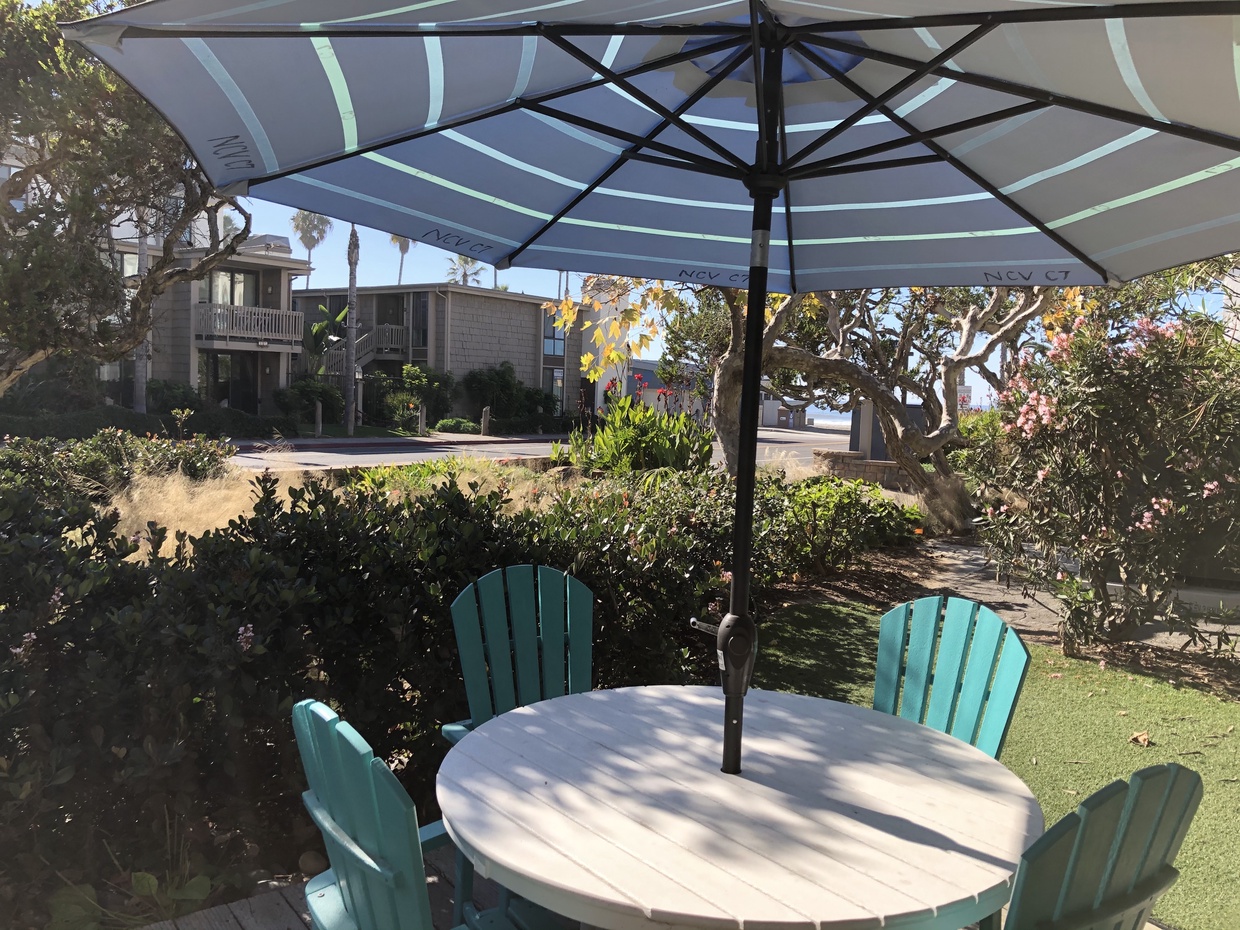 Enjoy relaxing on your ocean view private patio with adjoining grassy area! 