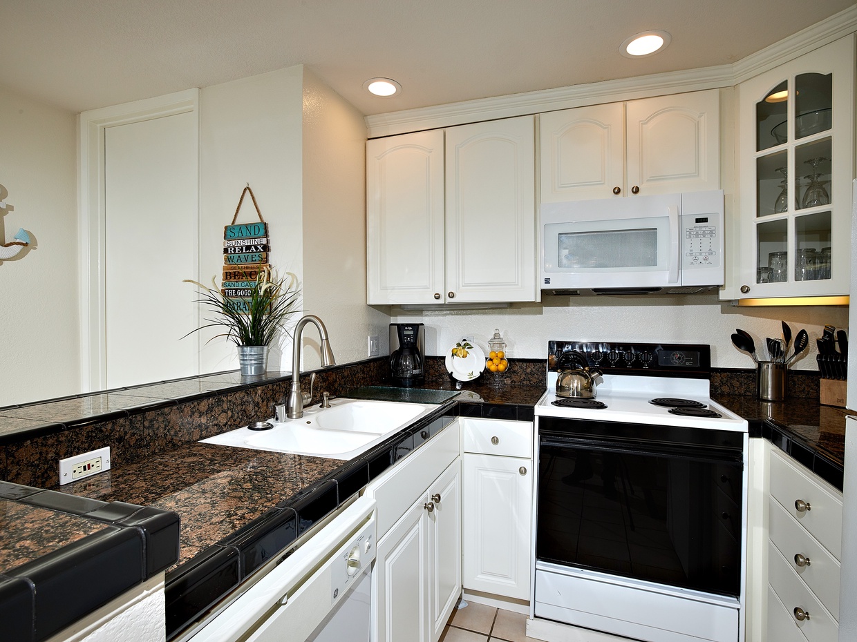 The remodeled kitchen is fully equipped with dishes, pots & pans, cooking utensils and serving pieces.