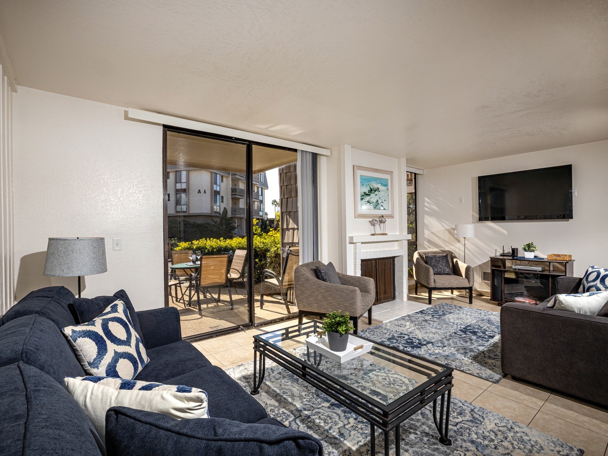The spacious living room is a welcome oasis after a day in the sun and surf!