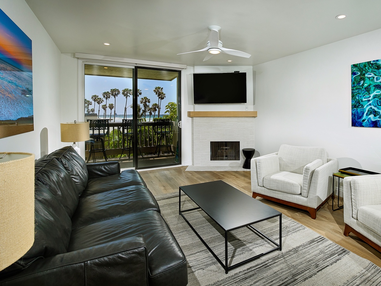 A cozy fireplace completes the ambiance in the living area.