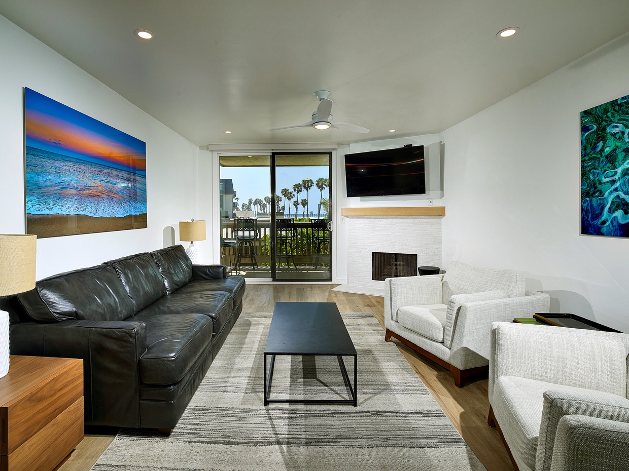 The ocean view living area is furnished with stylish and comfortable furniture. 