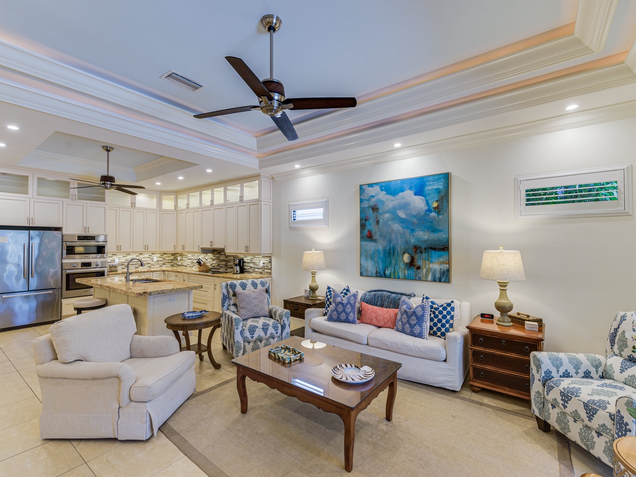 Spacious open-concept living room with 60” Smart TV