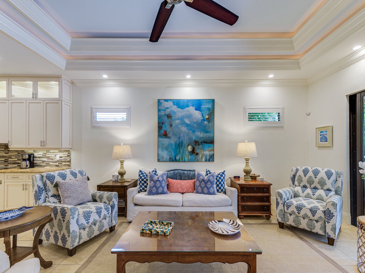 Spacious open-concept living room with 60” Smart TV