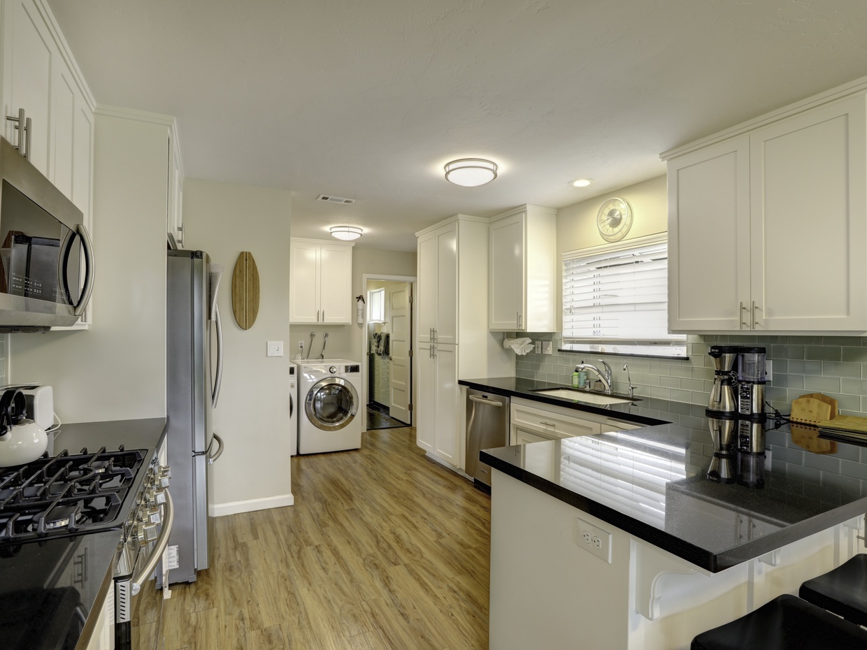 Modernized kitchen equipped with top-notch chef-grade appliances, perfect for crafting delectable culinary delights.