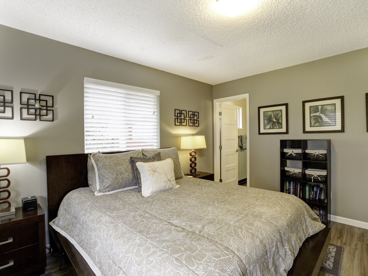 Experience luxury in the master bedroom with a queen-size bed and attached ensuite bathroom, where comfort meets elegance.