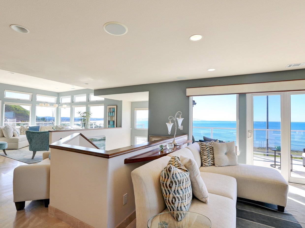 Up a flight of stairs to open living area with panoramic ocean views. Big open views from Pismo Dunes to Avila Beach.