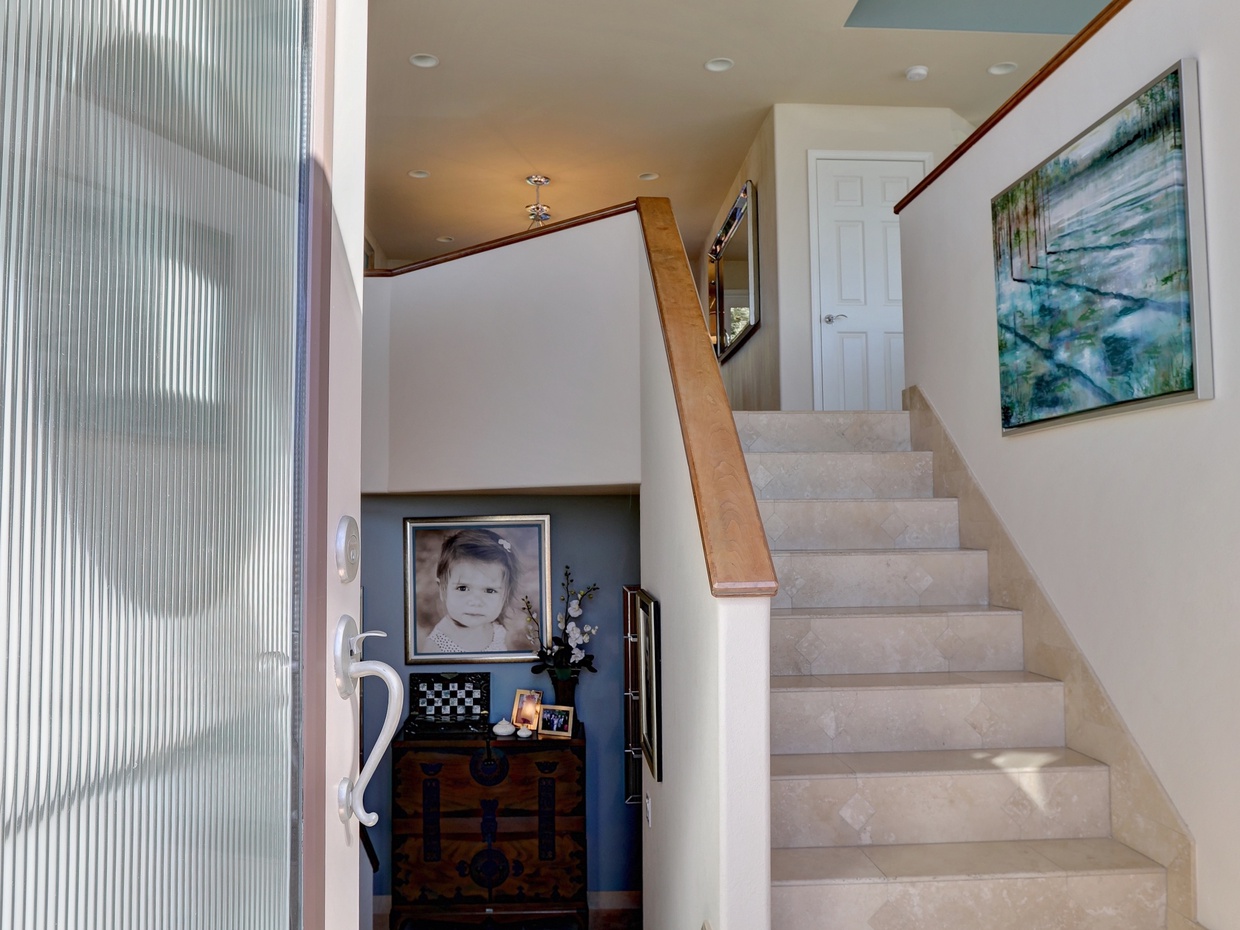 Split level entry. At first level is the guest bedroom with ensuite bathroom, office and garage access.