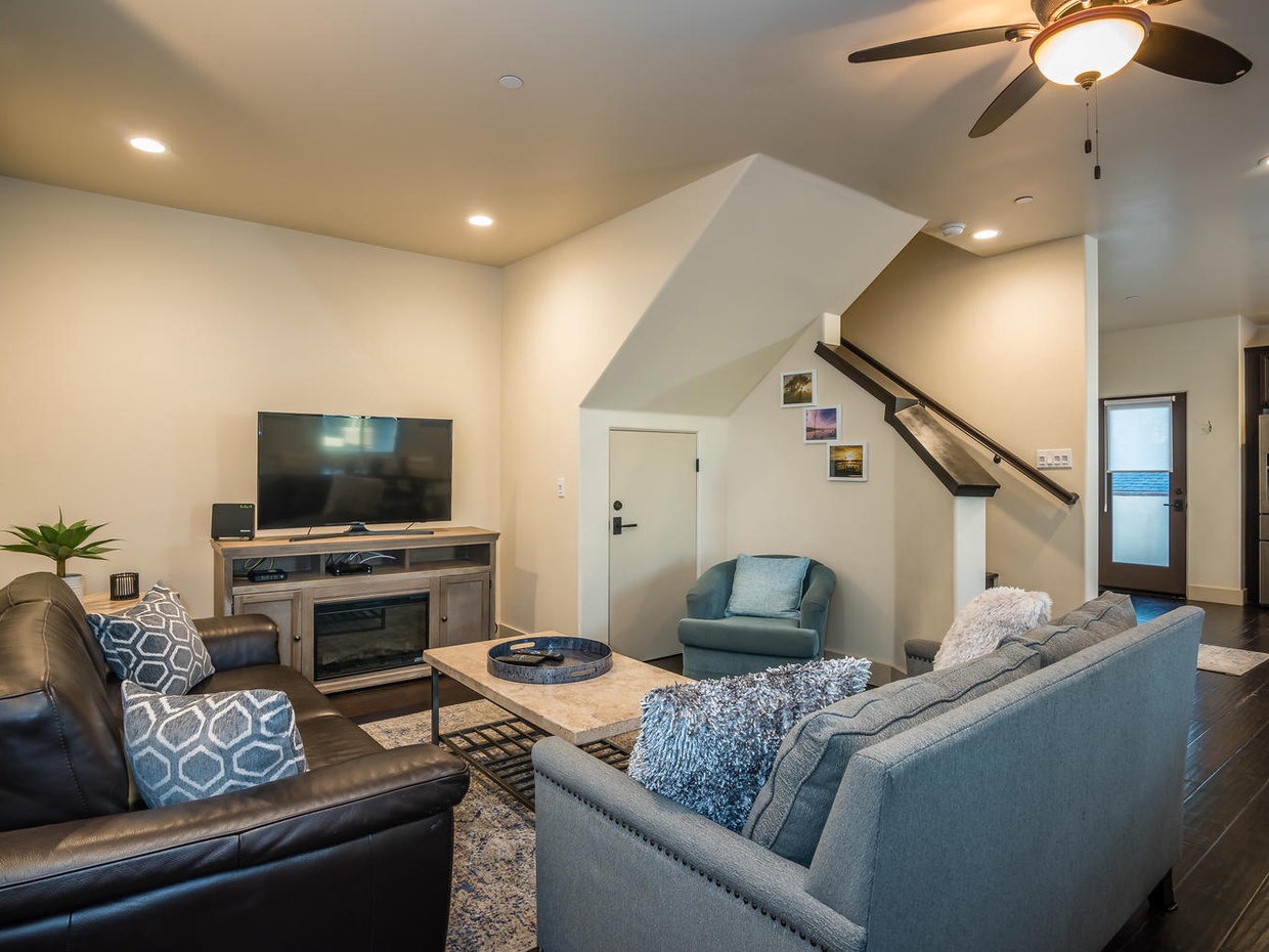 Living area opens to kitchen and dining. For additional sleeping there are two memory-foam tri-fold mats (with bedding linens).