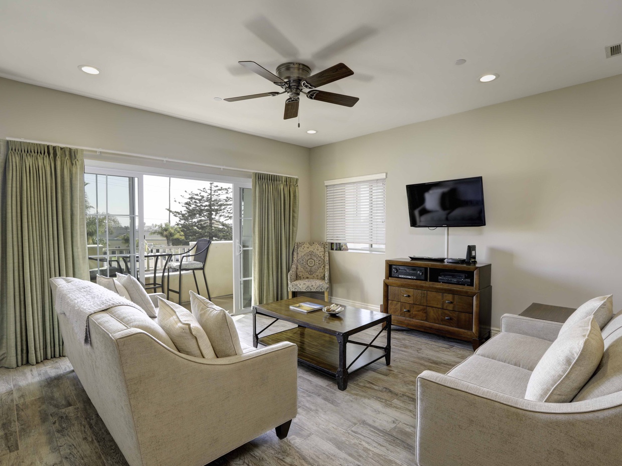 Living room located on second level. Balcony with ocean view and natural gas BBQ. Queen sleeper sofa in living room.