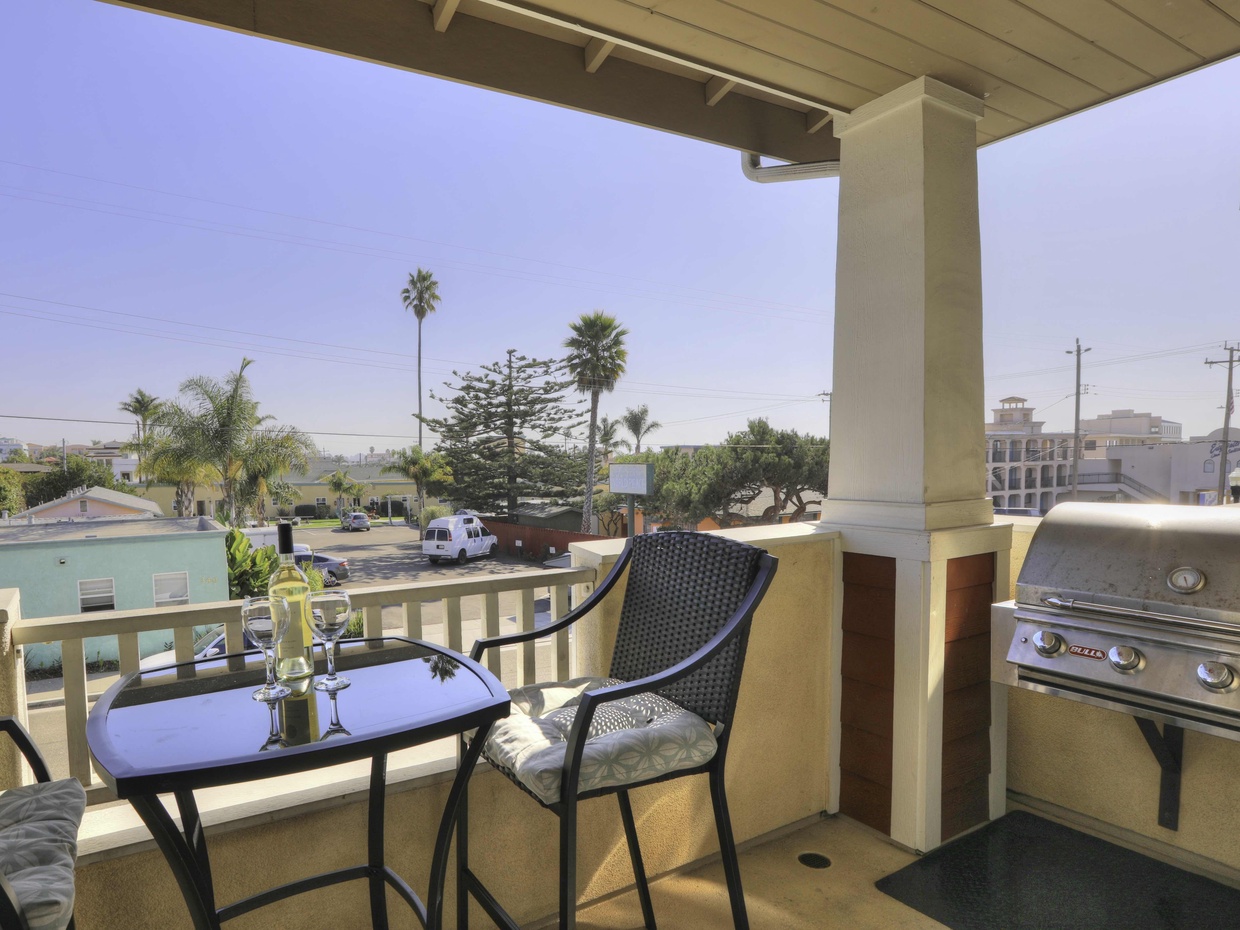 Private balcony just off living room area. Natural gas BBQ. There is a bistro table with 4 chairs.