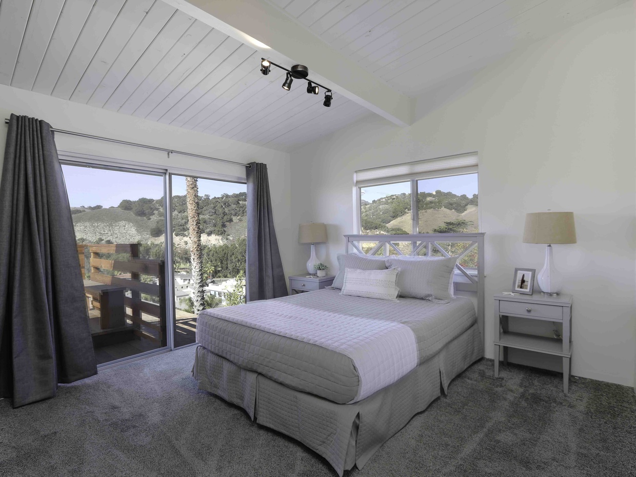 Master bedroom has a queen bed with a Tuft & Needle mattress. Entry to the deck with big Avila Beach views is through the Master bedroom and living room.