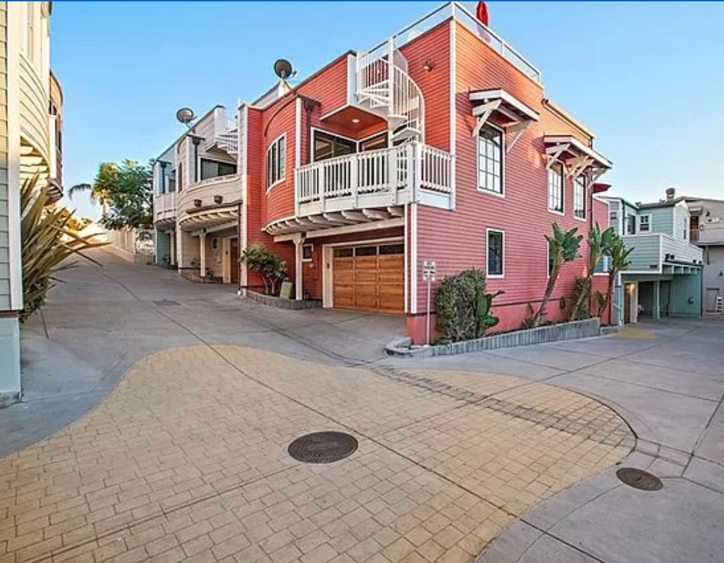 One of the few corner units in the private, gated complex, this town-house style unit has it all.
