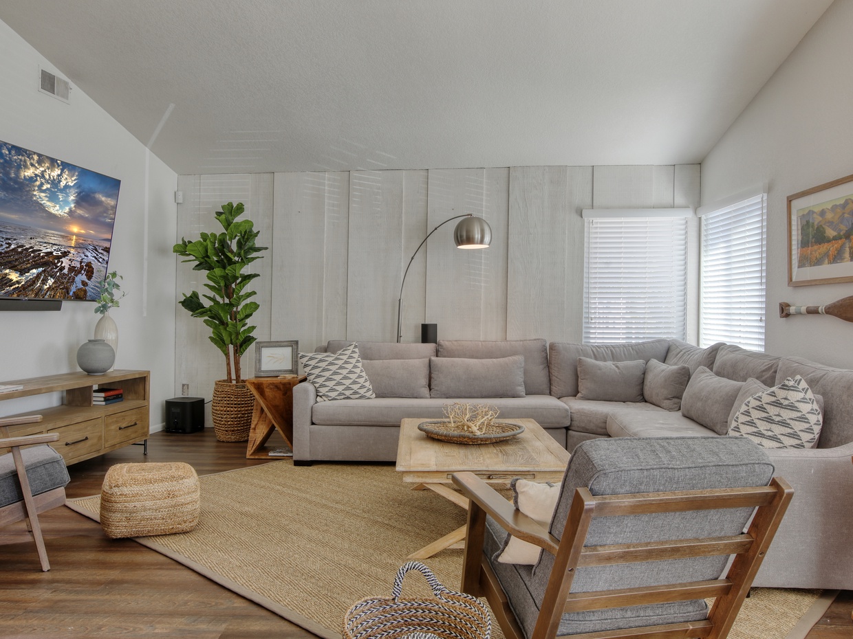 Living room has a large sectional for friends and family to gather. Big SmartTV to stream your favorite entertainment apps. Home has WiFI and SmartTVs. There is no cable channel lineup.