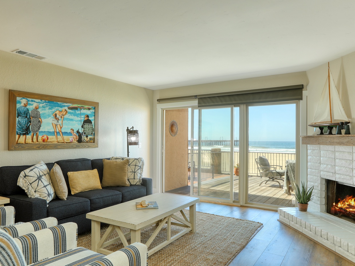 Enjoy uninterrupted white water views from the living room. Please be aware that the fireplace is not functional, but you can stay cozy with the patio fire table, perfect for taking the edge off the cool Pacific Ocean breeze.