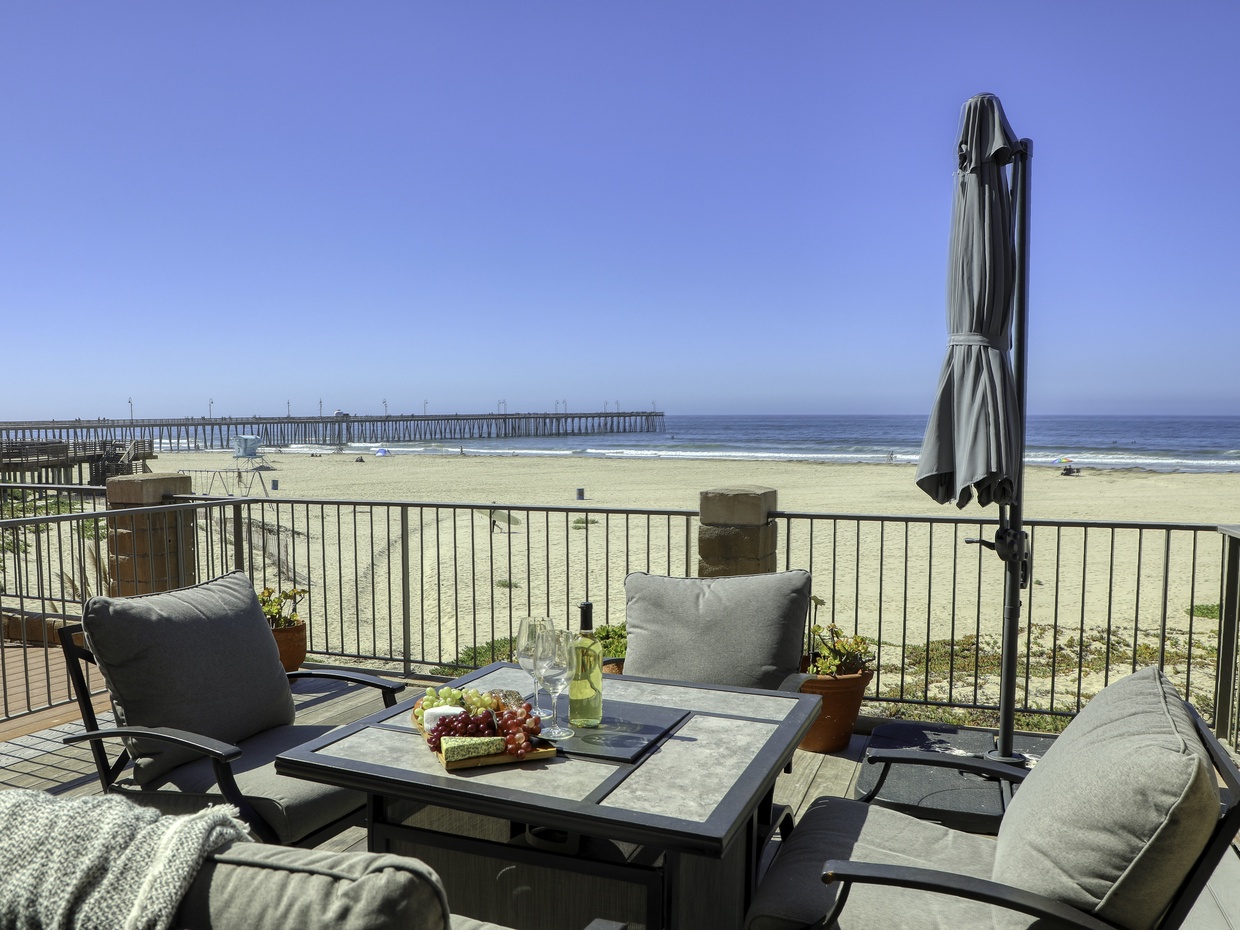 On the sandy beach! Gather around the fire table to enjoy pink and orange painted skies.