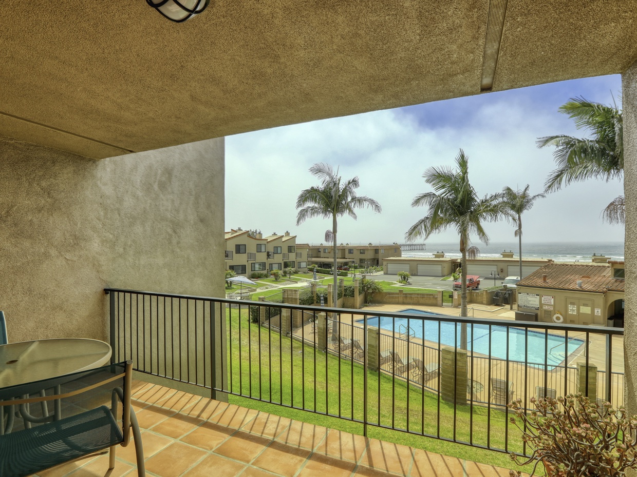 Native palms frame Pacific ocean views from your private outdoor balcony.