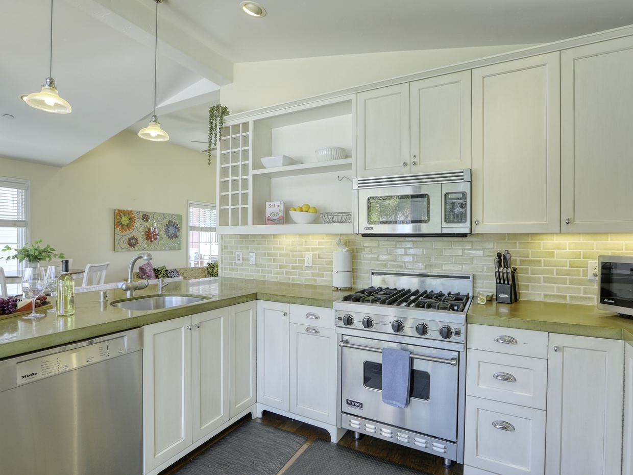 Stainless steel oven and appliances lend a hand to dining at home.