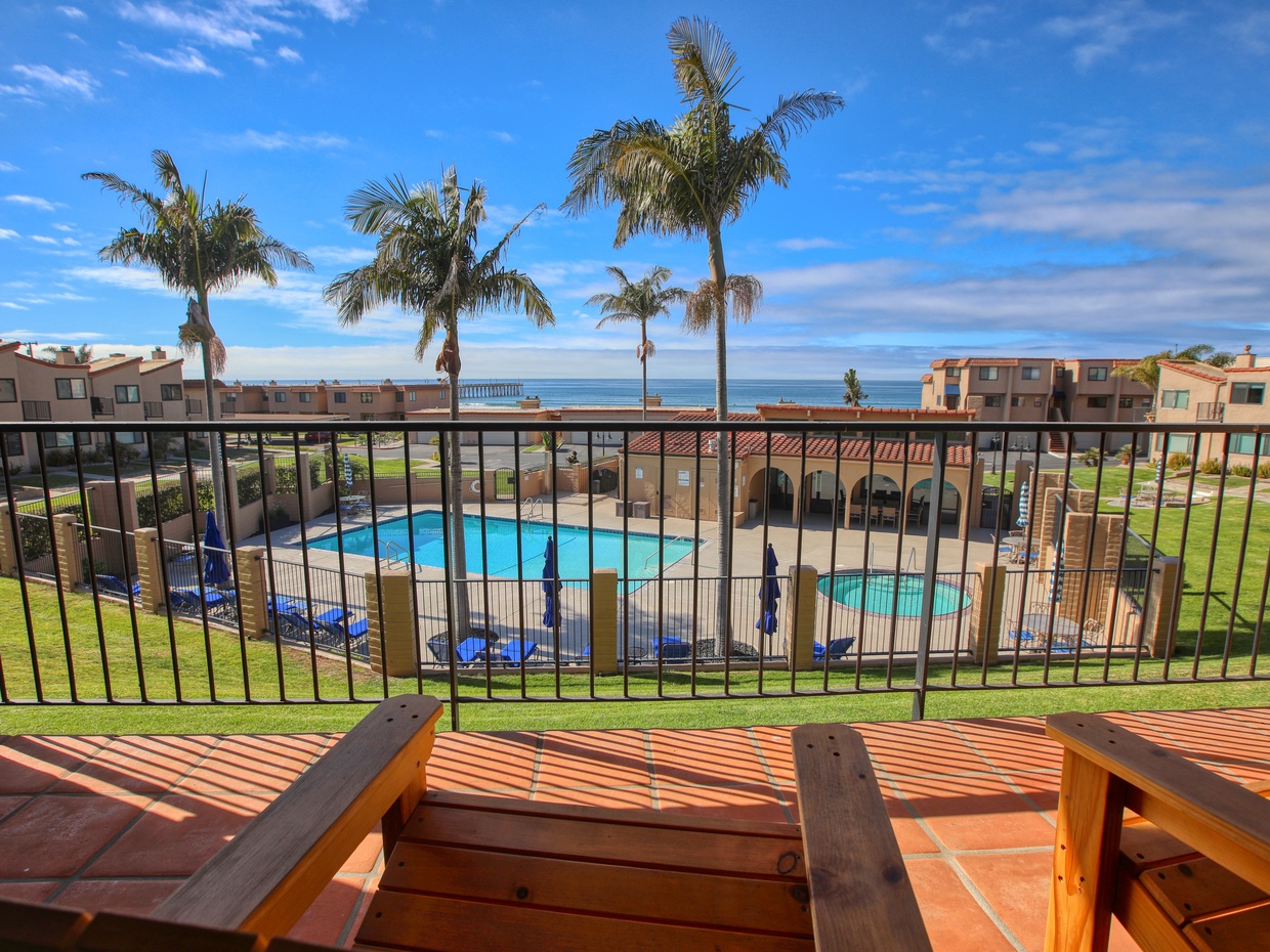 Nestled just steps from the sand, this charming condo offers the perfect spot to unwind and soak up the coastal vibes