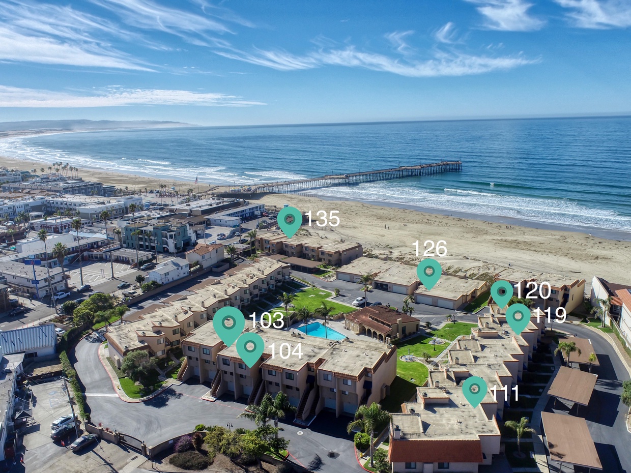 Unit 120 sits just steps from the sand — a corner retreat with a peek-a-boo ocean view from the master bedroom balcony, perfect for catching coastal sunrises and salty sea breezes.