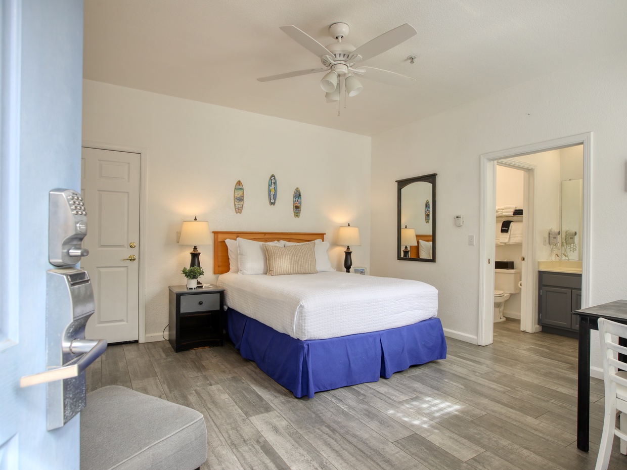 Welcome to The Shark Shack, Unit 303! This cozy downstairs studio features a comfy queen bed and a compact kitchenette—perfect for your seaside escape. 